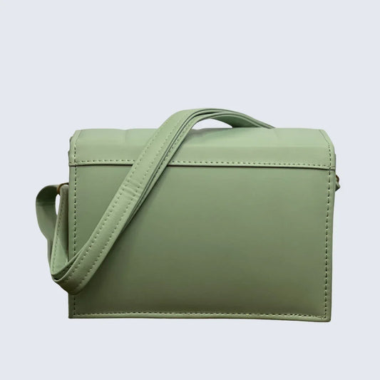 Green handbag with a strap on a light gray background