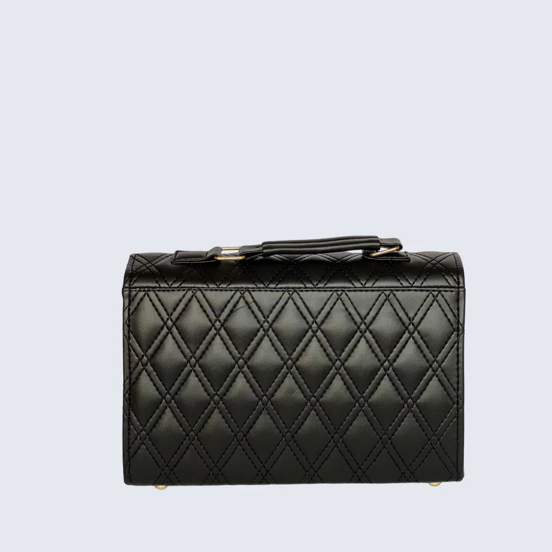 Black quilted handbag on a light gray background
